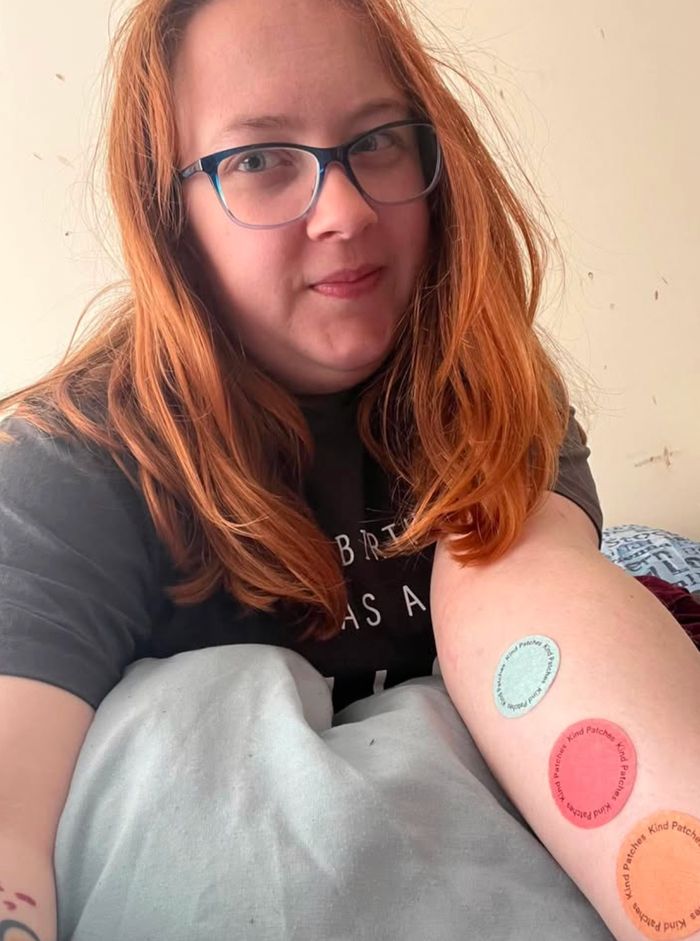 Kind Patches customer Chloe wearing three patches on her forearm
